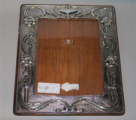 An Edwardian Art Nouveau silver mounted photo frame, William Neale, Chester, 1903, 30.4cm.